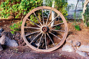 Fototapeta na wymiar old wooden wagon wheel