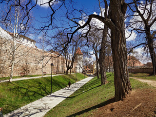 Walking in the park near the medieval wall of the old town of Sibiu, Transylvania, Romania