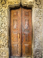 Old wooden door of a orthodox church in Bucharest, Romania.