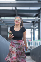 Young woman walking through the city.