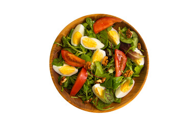green salad, egg, tomato in a plate isolated