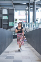 Young woman walking through the city.