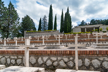 The military cemetery which contains the remains of 974 Italian soldiers who died during the fighting in the battles of Montelungo e Cassino during WWII - obrazy, fototapety, plakaty