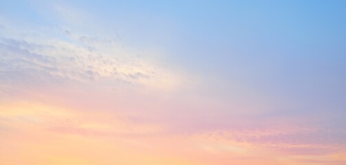 Clear blue sky. Pink and golden glowing clouds. Sunrise. Dramatic cloudscape. Concept art,...