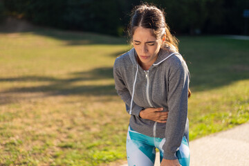 Young sporty woman has knee pain