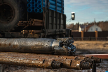 The drilling rig is drilling a well for water. Water extraction on a private plot of land.