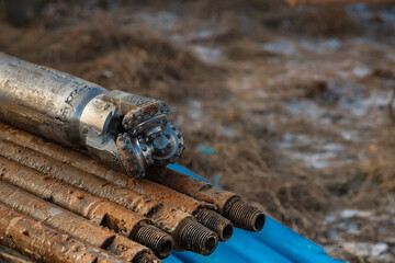 The drilling rig is drilling a well for water. Water extraction on a private plot of land.