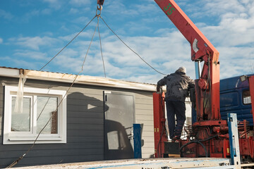 Delivery and installation of a modular frame house. Frame construction of small houses. Modular...