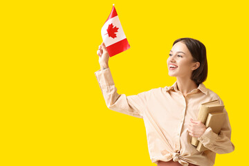 Female student with Canadian flag on color background