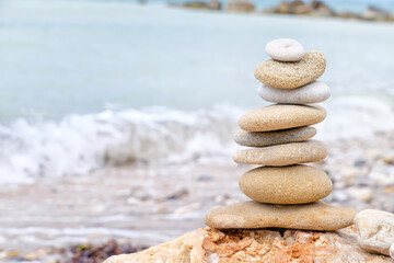 Fototapeta na wymiar Stack of pebbles on sea beach