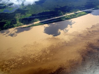 The Meeting of Waters (Portuguese: Encontro das Águas) is the confluence between the Rio Negro, a river with dark (almost black coloured) water, and the sandy-coloured Amazon River or Rio Solimões. 