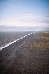 black sand beach from above