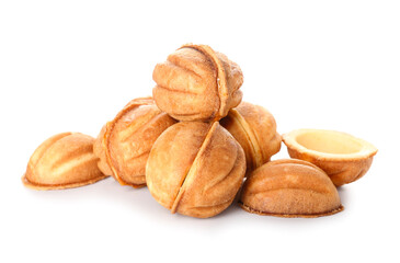 Tasty walnut shaped cookies with boiled condensed milk on white background