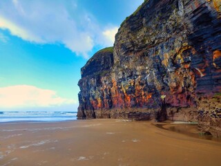 Beach scene with steep cliffs in Ireland, Ballybunion Beach, County Kerry