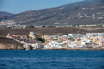 Fototapeta premium View on resorts and beaches of South coast of Tenerife island during sail boat trip along coastline, Canary islands, Spain
