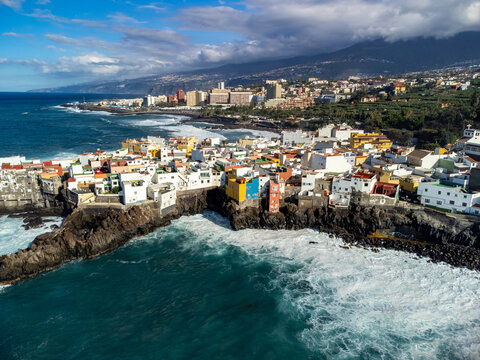 Aerial view on colorful houses and black lava rocks in small village Punta Brava near Puerto de la Cruz, Tenerife, Canary islands