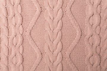 Knitted woolen sweater as background, closeup