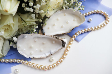 bouquet of flowers, sea shells with pearls and pearl beads 