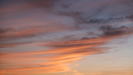 Dramatic orange gray purple sky and clouds at sunset for background, colorful dramatic sky with cloud at sunset, sky texture. sunset, evening sky, background