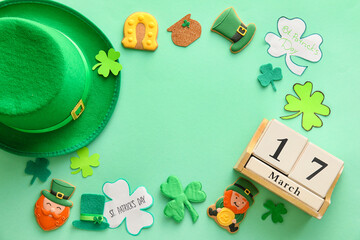 Frame made of tasty gingerbread cookies for St. Patrick's Day celebration on color background