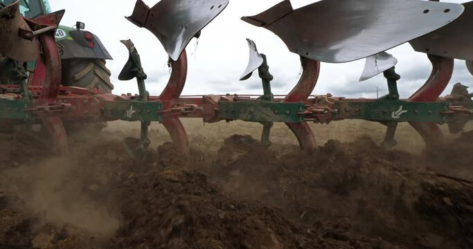 Tractor ploughing a field , Brittany, France