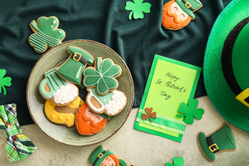 Composition with tasty gingerbread cookies for St. Patrick's Day celebration on color background