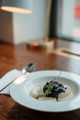 Lazy dumplings on a white plate in a cafe