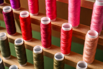 Set of different colorful sewing threads on coils