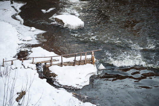 Lamprey catching in snowy winter day. Kuldiga, Latvia