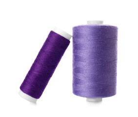 Purple sewing thread spools on white background