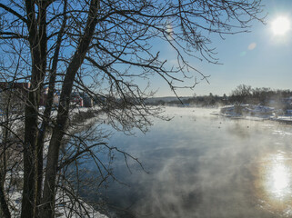 Icy rive with smog in the morning  in the Canadian cold winter in the province of Quebec