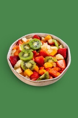 Fruits on green background