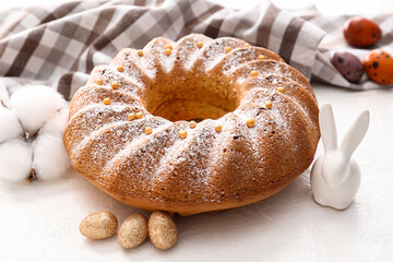 Tasty Easter cake and decor on white background