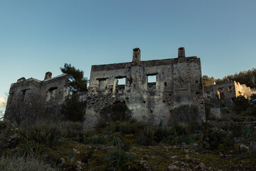 Obraz premium Abandoned houses of ancient village. This place known as ghost town. Must visit places. Fethiye, Muğla, Turkey.