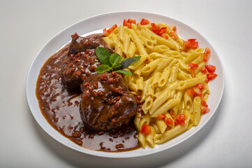 Penne pasta with roast beef and bacon