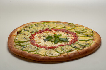 Mozzarella pizza with zucchini sautéed with garlic and herbs