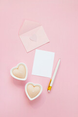Happy Valentines Day composition. Blank greeting card mockup on pink background