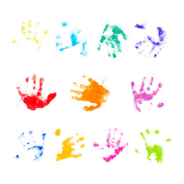 Set of multicolored prints of children palms on a white background. Hands in paint