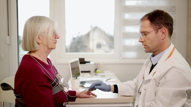 Doctor checking up on patients respiratory illness.