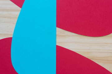 blue form on two red elements and wood