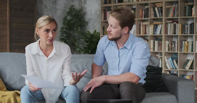 Family couple quarrel high payment bills fine mortgage indebtedness check paper documents at home. Husband and wife discussing legal divorce contract having difficulties relationship marriage problems