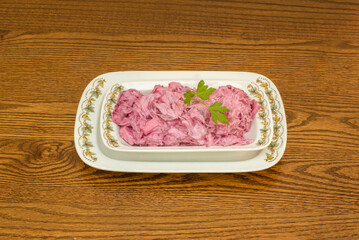 herring salad-german style salad. It has beets, potatoes, carrots, onions, pickles, eggs and mayonnaise.