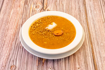 Lentils with chorizo are a traditional stewed culinary preparation from the province of Ávila. The popularity of the Spanish cuisine dish with various variants of meat from the slaughter