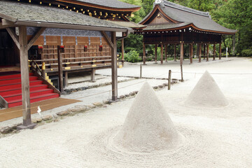 Tatezuna - elegant cone-shaped sand structures in Kamigamo-jinja shrine in Kyoto - UNESCO World Heritage Site