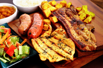 chicken beef and chorizo with fried plantains