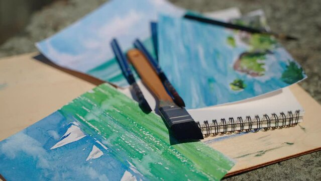 beautiful aquarelle pictures with marine landscapes and painting tools