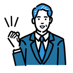 笑顔でガッツポーズをしているスーツを着た中年男性

