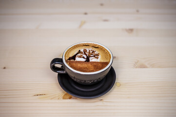 Artist draw coffee on table with wood background and coffee beans