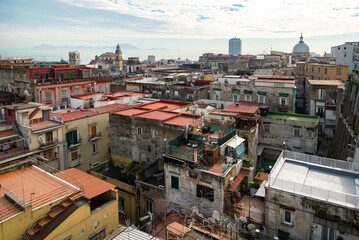 Fototapeta na wymiar Old overcrowded apartment houses with balconies - dense living in overpopulated Napoli center, Italy