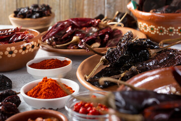 A closeup view of a variety of dried chile peppers.